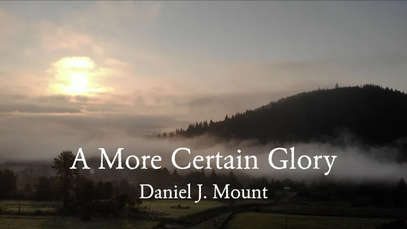 Image of the sun over a tree-covered mountain with the superimposed text "A More Certain Glory Daniel J. Mount"